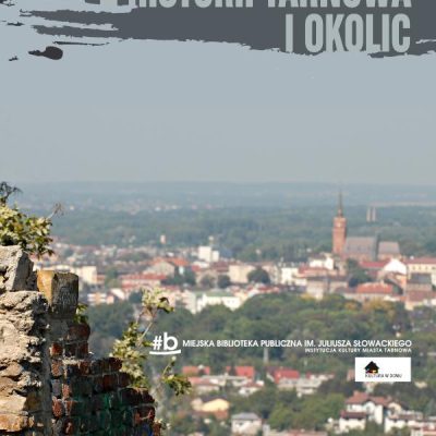 Panorama miasta widoczna ze wzgórza. Na pierwszym planie fragment ruin.